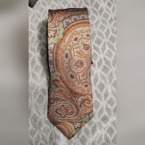 Peter Millar Paisley Tie in Orange and Green. It Has A Small Tear .